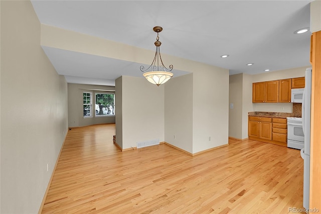 9930 W Progress Pl, Littleton, CO 80123 - unfurnished dining area with light wood-type flooring and recessed lighting