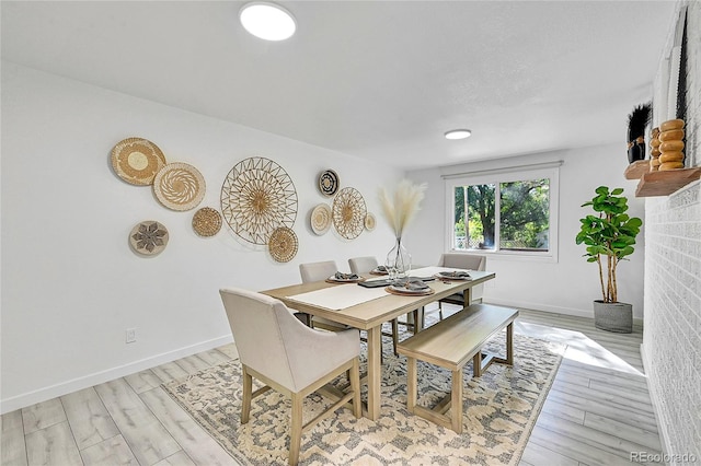 dining room with light hardwood / wood-style floors