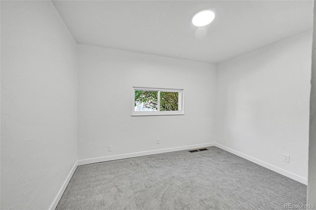 unfurnished room with carpet floors