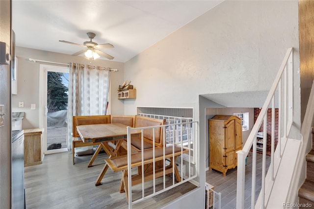 dining room featuring ceiling fan, breakfast area, and hardwood / wood-style floors