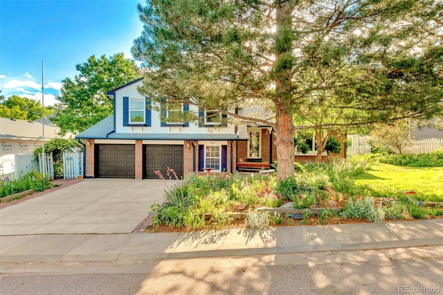 7681 S Jellison St, Littleton, CO 80127 - view of front facade featuring an attached garage, driveway, and brick siding