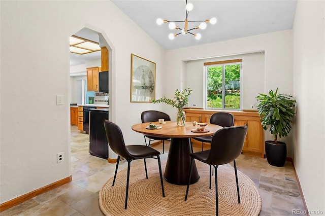 7681 S Jellison St, Littleton, CO 80127 - dining space with a chandelier and arched walkways