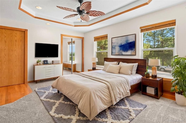 7681 S Jellison St, Littleton, CO 80127 - bedroom with a tray ceiling, multiple windows, a ceiling fan, recessed lighting, and a closet