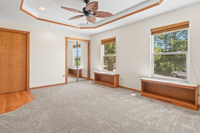 7681 S Jellison St, Littleton, CO 80127 - carpeted spare room with a tray ceiling, plenty of natural light, ceiling fan, and recessed lighting