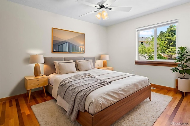 7681 S Jellison St, Littleton, CO 80127 - bedroom featuring wood finished floors and a ceiling fan
