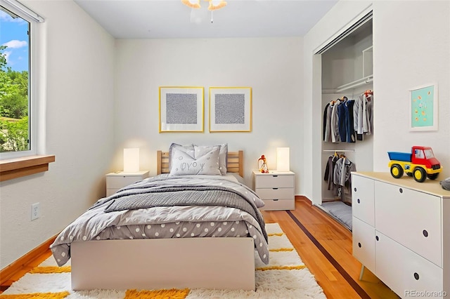 7681 S Jellison St, Littleton, CO 80127 - bedroom featuring light wood-type flooring and a closet