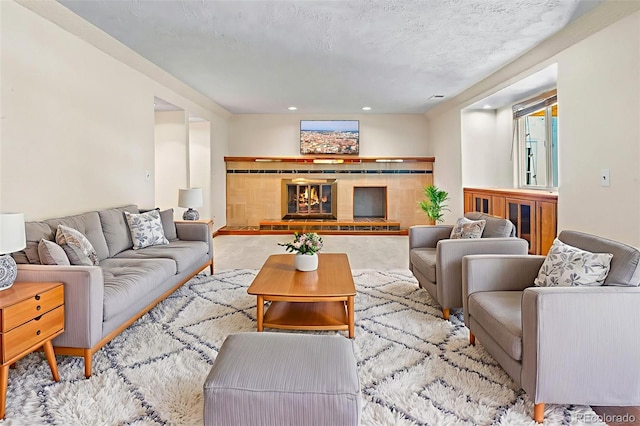 7681 S Jellison St, Littleton, CO 80127 - carpeted living area featuring a tiled fireplace and recessed lighting