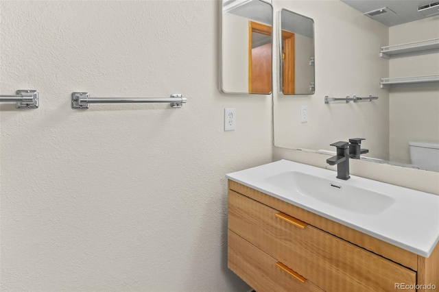 7681 S Jellison St, Littleton, CO 80127 - bathroom featuring vanity and toilet
