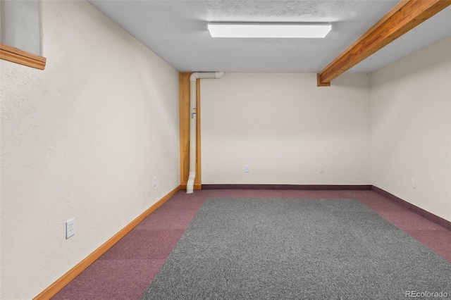 7681 S Jellison St, Littleton, CO 80127 - finished below grade area featuring dark colored carpet and baseboards