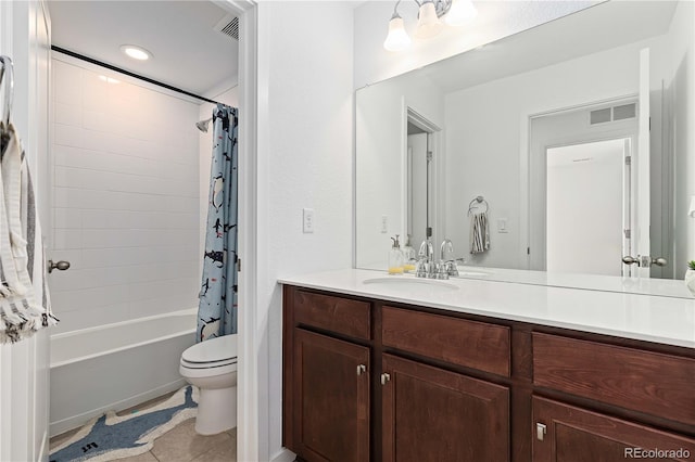 full bathroom featuring shower / bath combo with shower curtain, tile patterned floors, vanity, and toilet