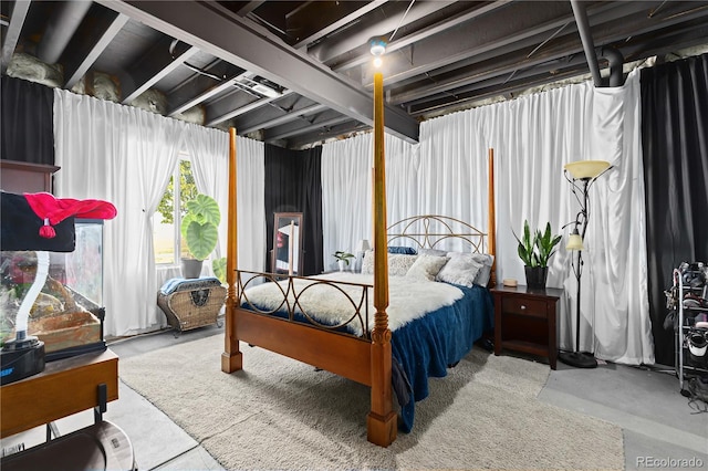 bedroom featuring concrete floors