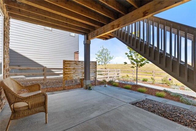 view of patio / terrace with a rural view