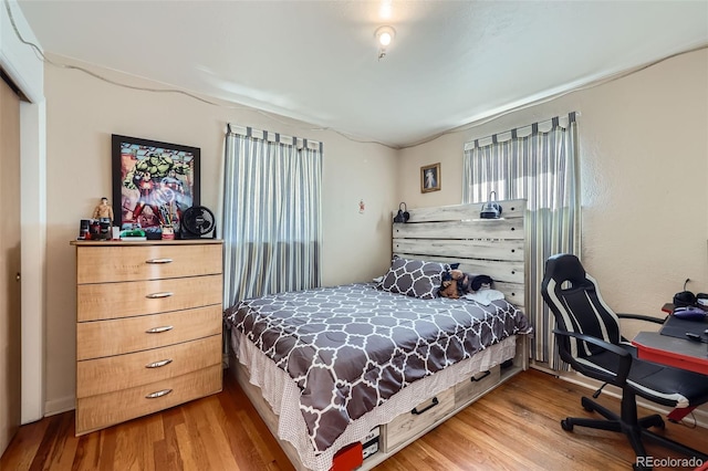 bedroom with light wood-type flooring