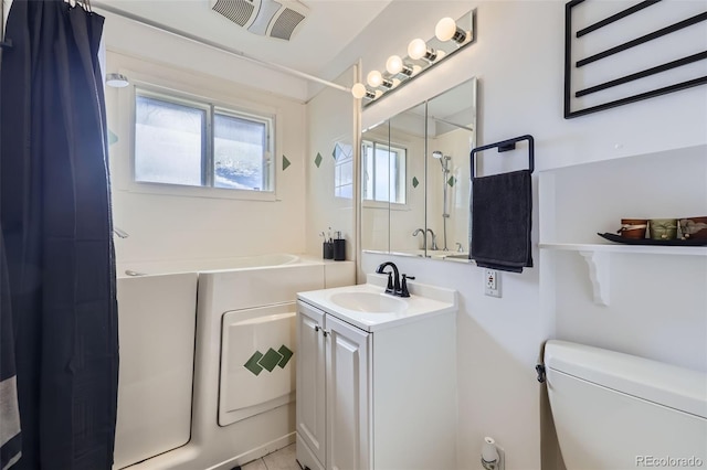 bathroom with vanity and toilet