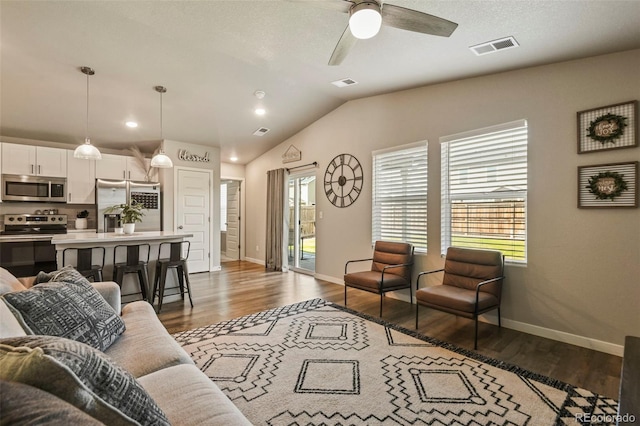 719 S Hoover Ave, Fort Lupton, CO 80621 - living area with wood finished floors, baseboards, ceiling fan, lofted ceiling, and recessed lighting