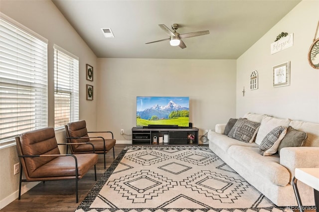 719 S Hoover Ave, Fort Lupton, CO 80621 - living area with wood finished floors, a ceiling fan, and baseboards