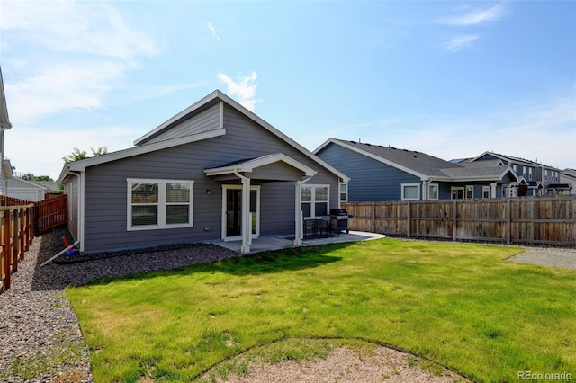 719 S Hoover Ave, Fort Lupton, CO 80621 - rear view of house with a patio area
