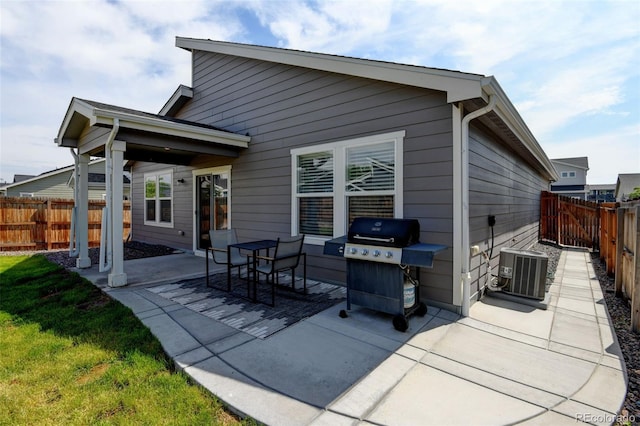 719 S Hoover Ave, Fort Lupton, CO 80621 - rear view of house featuring a patio, a fenced backyard, and cooling unit
