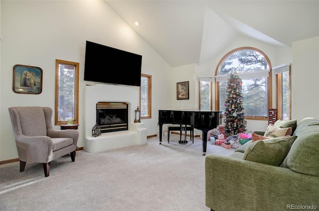 carpeted living room featuring high vaulted ceiling