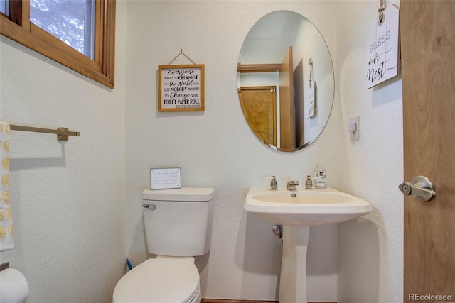 bathroom with toilet and sink