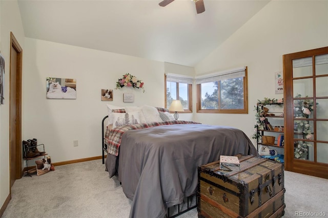 bedroom with ceiling fan, light colored carpet, and vaulted ceiling