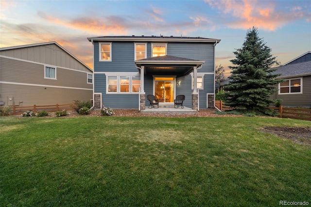 19067 W 57th Dr, Golden, CO 80403 - rear view of house with a patio