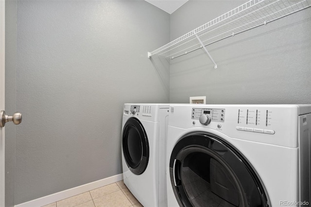 19067 W 57th Dr, Golden, CO 80403 - laundry room with washing machine and clothes dryer and light tile patterned floors