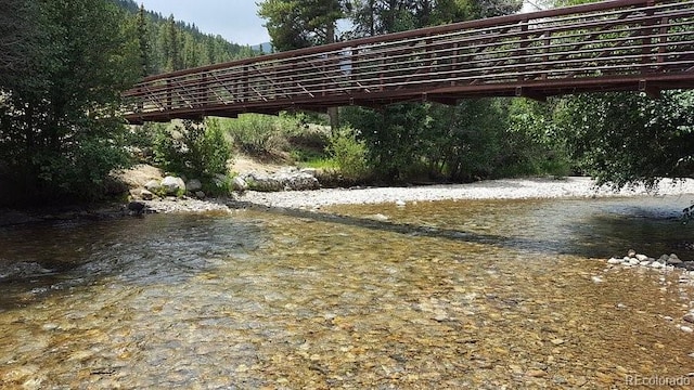 19067 W 57th Dr, Golden, CO 80403 - water view featuring a forest