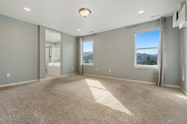 19067 W 57th Dr, Golden, CO 80403 - unfurnished room with light carpet and recessed lighting