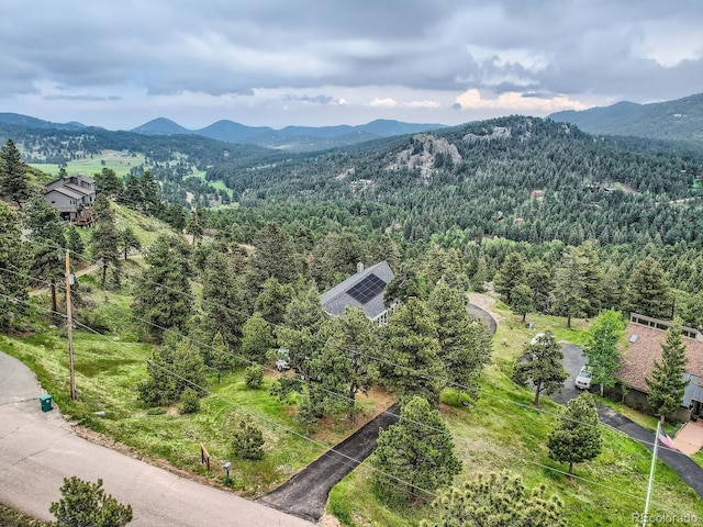 7273 Silverhorn Dr, Evergreen, CO 80439 - drone / aerial view of mountains and a forest