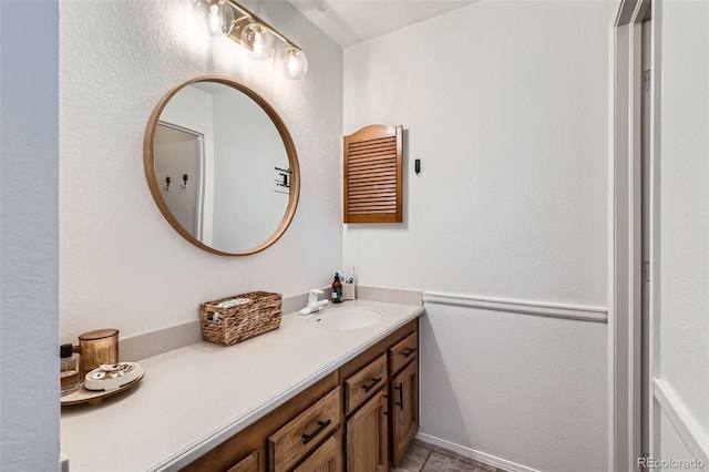 bathroom with vanity and tile patterned flooring