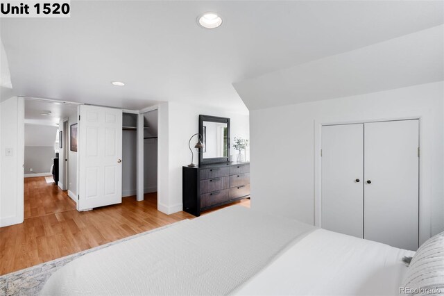 bedroom featuring recessed lighting, baseboards, and wood finished floors
