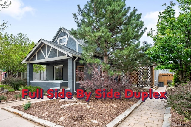 1518-1520 S Sherman St, Denver, CO 80210 - view of front of home with brick siding, fence, and a porch