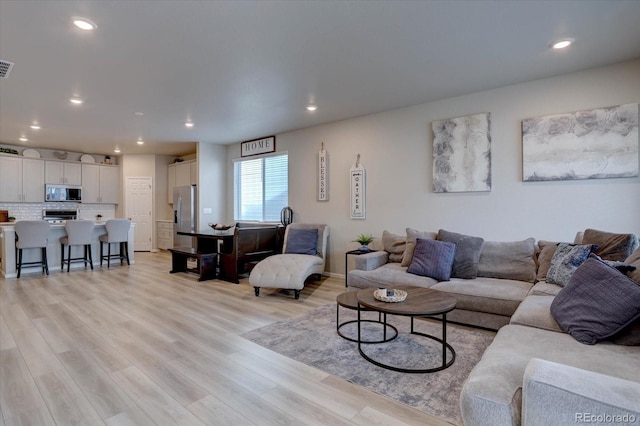 2785 Black Hawk Pl, Brighton, CO 80601 - living room with light wood-style flooring and recessed lighting