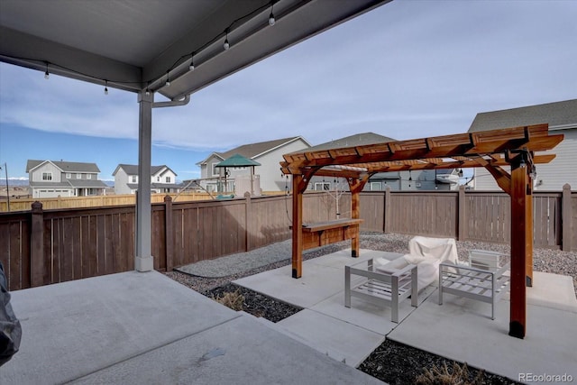 2785 Black Hawk Pl, Brighton, CO 80601 - fenced backyard with a pergola, a patio area, an outdoor living space, and a residential view