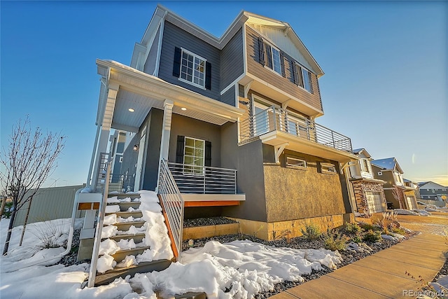 4072 N Rome St, Aurora, CO 80019 - view of front facade featuring a balcony and stucco siding