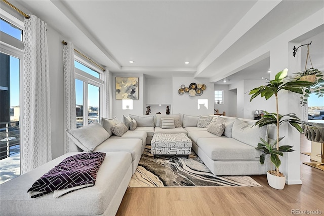 4072 N Rome St, Aurora, CO 80019 - living room featuring recessed lighting, wood finished floors, and a tray ceiling