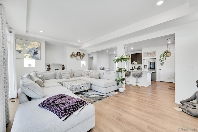 4072 N Rome St, Aurora, CO 80019 - living room featuring light wood-type flooring, recessed lighting, and a raised ceiling