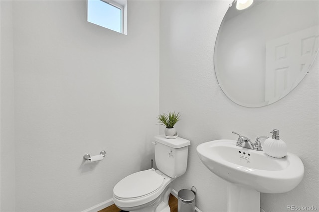 bathroom with toilet and sink