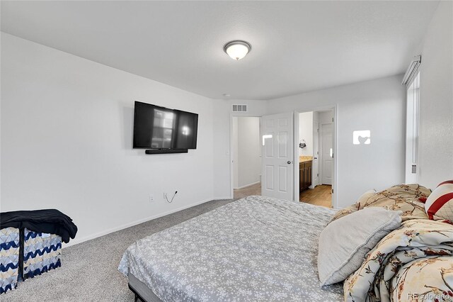 4072 N Rome St, Aurora, CO 80019 - bedroom featuring light colored carpet and ensuite bathroom