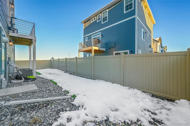 4072 N Rome St, Aurora, CO 80019 - snow covered property with a fenced backyard and a balcony