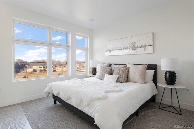 carpeted bedroom featuring multiple windows