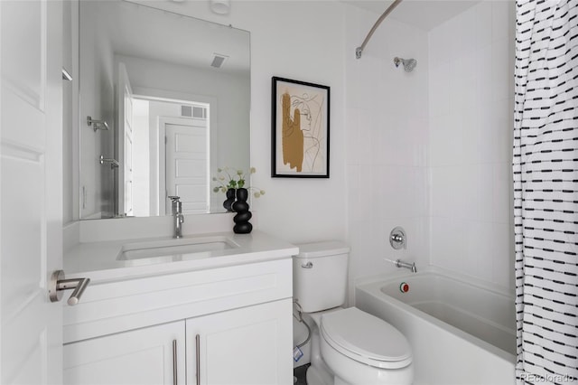 full bathroom with vanity, toilet, and tiled shower / bath combo