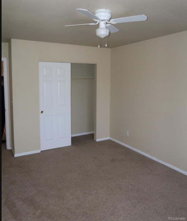 unfurnished bedroom with ceiling fan, a closet, and carpet floors