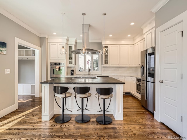 kitchen featuring appliances with stainless steel finishes, white cabinetry, crown molding, and island range hood