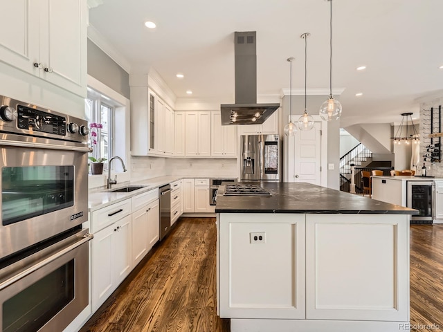 kitchen with island range hood, a kitchen island, a sink, white cabinetry, and appliances with stainless steel finishes