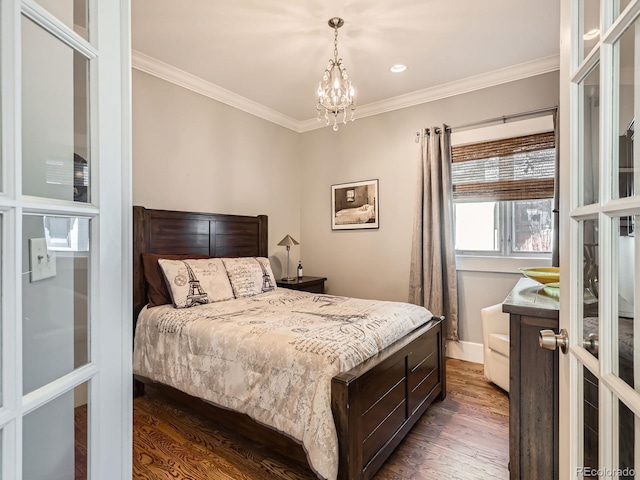 bedroom with ornamental molding, dark wood-type flooring, baseboards, and an inviting chandelier