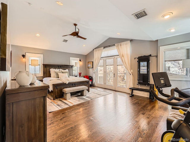 bedroom with lofted ceiling, access to outside, multiple windows, and visible vents