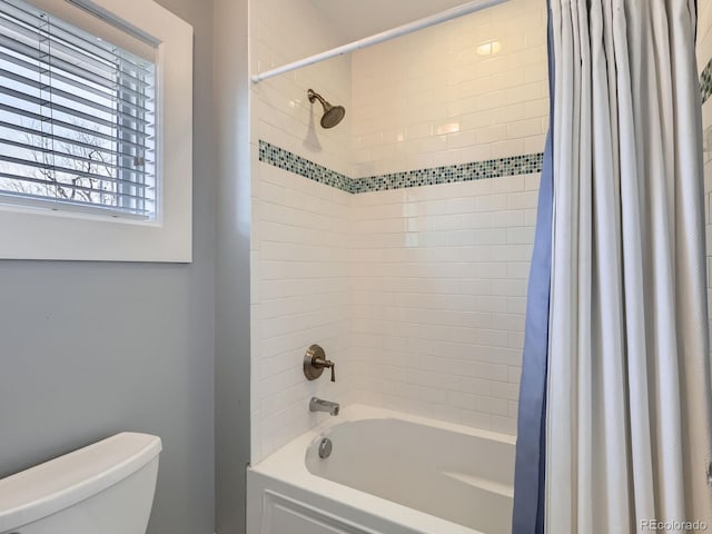 full bath featuring toilet and shower / bathtub combination with curtain