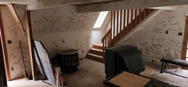 1 Ute Trl, Evergreen, CO 80439 - stairs featuring a wood stove and a skylight